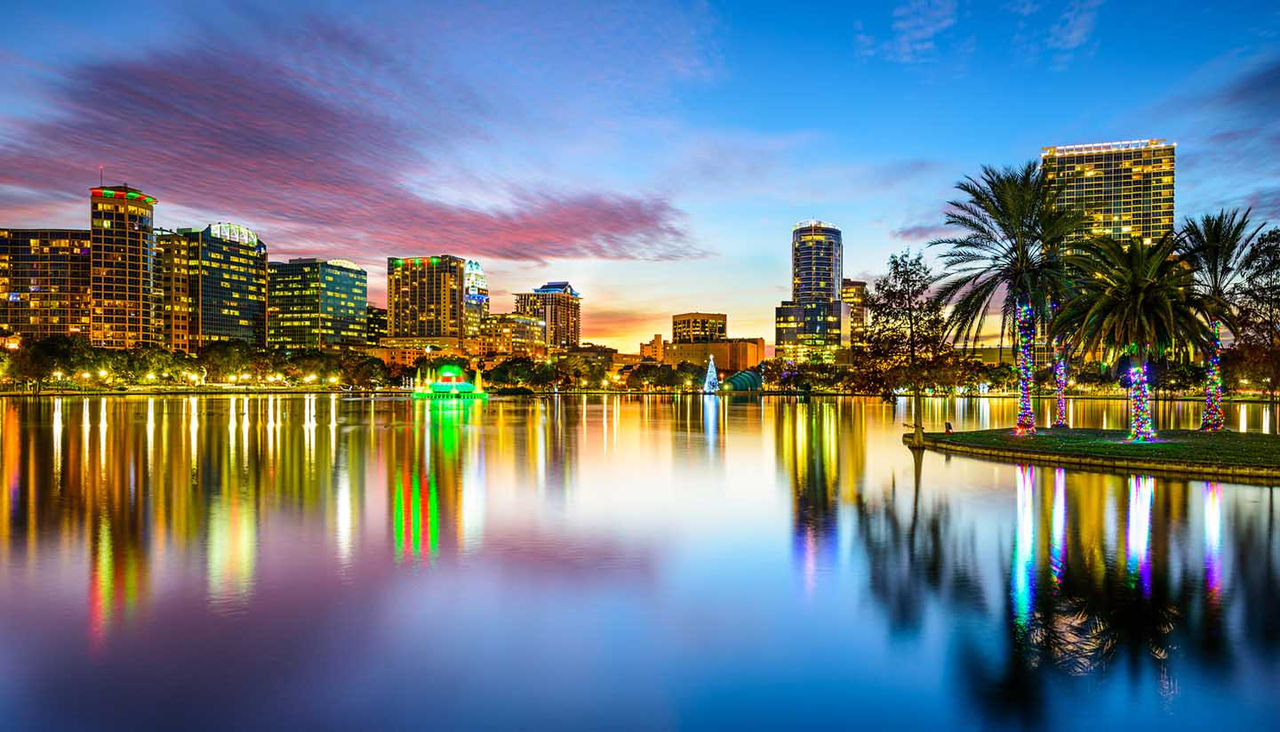 Orlando, Florida, USA downtown city skyline on Eola Lake.